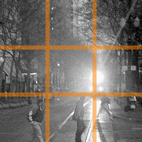 An early springtime scene on the north side of Pioneer Square, Portland, Oregon; superimposed with lines dividing the photo into nine more or less equal parts.